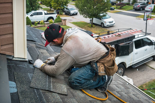 Professional Roofing technician working in Augusta, IL